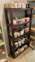 Plastic Shelf Full of Assorted Coffee Mugs