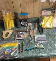 Miscellaneous tools and garden items in a dewalt