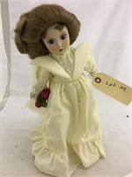 Porcelain doll with stand