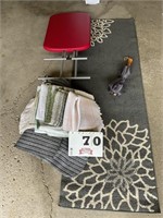 Rugs, folding table and umbrella