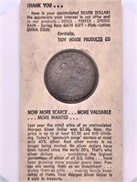 1883 Morgan Silver Dollar in rare Tidy Huse sleeve