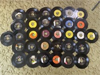 32 45 rpm records from various artists.