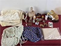 Group of figurines ,flour sack towels bonnet and