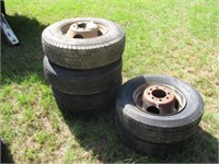 Four 9.50 R16.5 tires w/8-hole rims