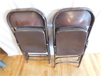 Four metal folding banquet chairs
