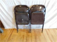 Four metal folding banquet chairs