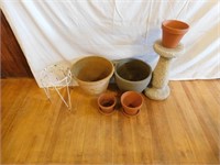 Lot of clay flower pots and stands