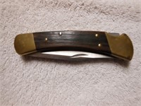 Folding knife by Buck  3.5" blade/9" long