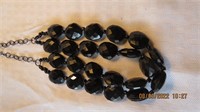 9 in black costume jewelry necklace