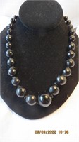 9 in bloack beads necklace slight imperfection in