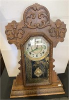 Antique gingerbread mantle clock with the