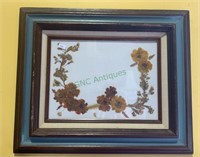 Vintage framed linen with pressed flowers -