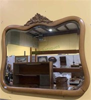 Medium size antique wood framed wall mirror or