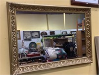 Highly decorated gold framed large wall mirror