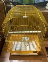 Smaller size yellow metal birdcage with a