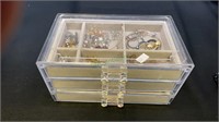 Clear plexiglass jewelry box with three velvet