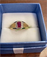 Karis Collection gold tone ring with a ruby