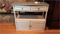White cabinet with marble top