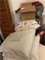 Large assortment of bedding, pillows, lace