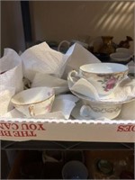 Tea cups and saucers, plates, assorted dishes