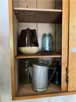 Contents of cabinet, coffee pots, jars, glass