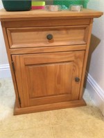 Wooden side table with drawer and door