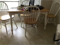 Wooden table with five matching chairs. Contents