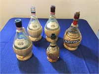 Vintage straw rattan wine bottles