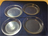 Four pieces of Pyrex pie plates