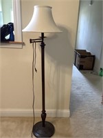 Metal standing lamp with shade arm moves very