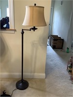 Standing metal lamp with arm and shade very heavy