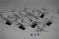 Eight Different Boeing Airplane Models on Stands