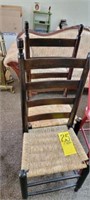 two matching ladder back rockers with cane seats