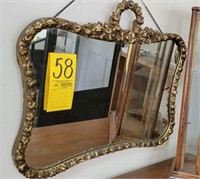 wall mirror with ornate frame