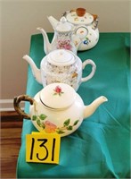 four teapots including Franciscan