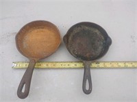 2 small cast iron pans