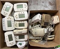 Box of various Honeywell thermostats