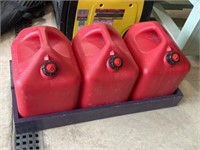 Three 5 gallon gas cans