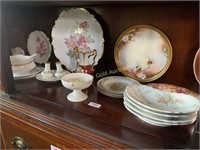 Shelf full of assorted china items