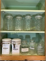 Upper cabinet full of canisters