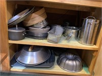 Pans and cookware in lower cabinet
