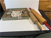 Two rolling pins and a box of cookie cutters