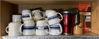 Shelf of coffee mugs and more