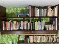 Three shelves of assorted cookbooks