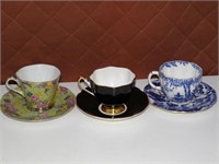 3 collectible cups and saucers