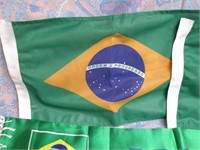 2 Brazilian flags and football scarves