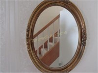 Ornate oval mirror