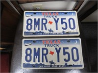 TWO MATCHING TEXAS SPACE SHUTTLE LICENSE PLATES