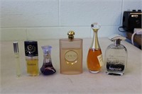 6 Partial Bottles of Perfume Including Opium,