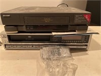 2 VHS players, Toshiba and Sharp.